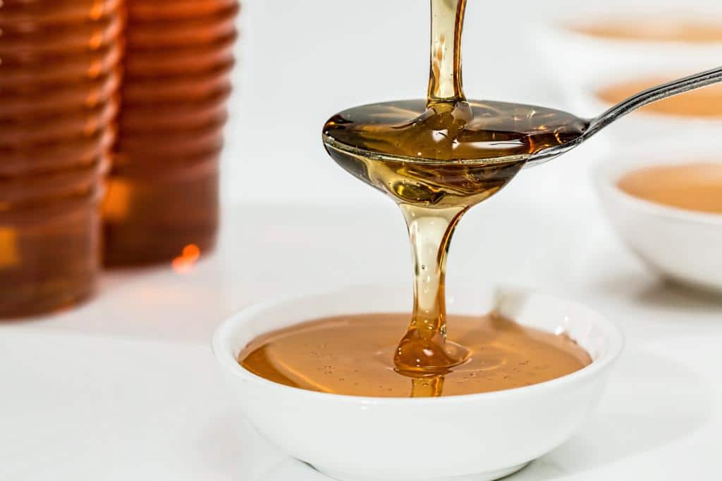 honey in a pot with spoon