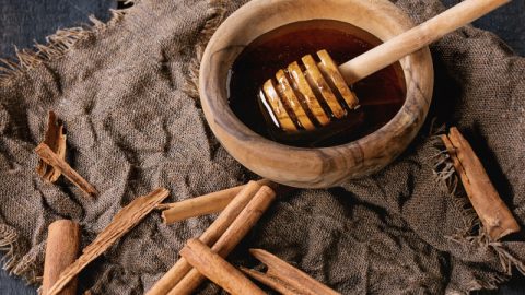 Cinnamon sticks and honey pot